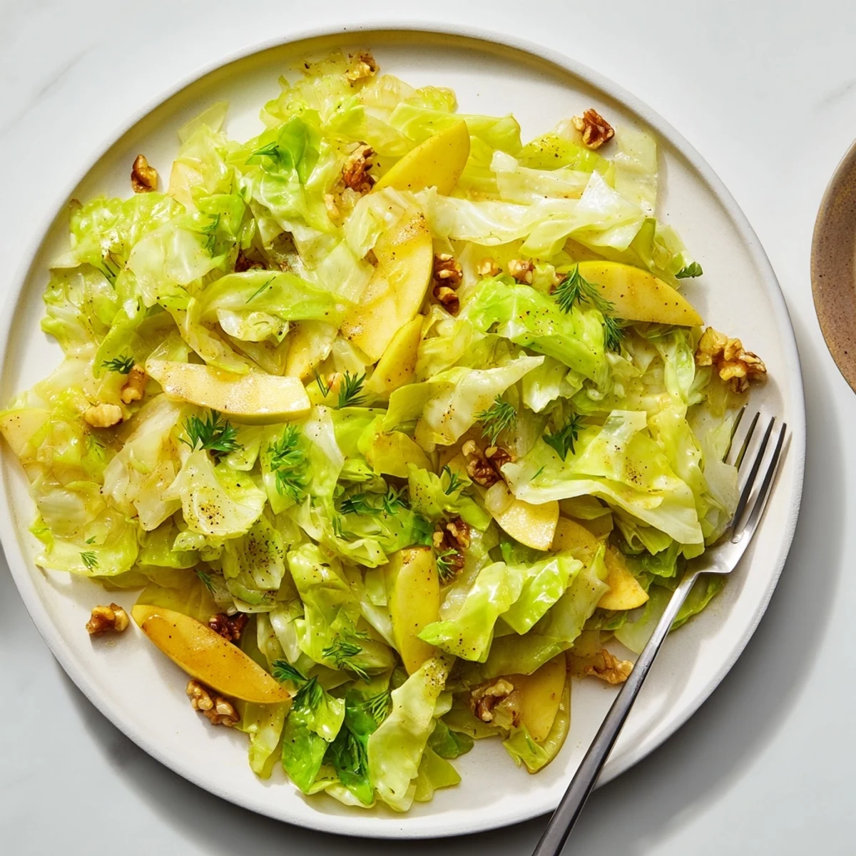Crisp cabbage and apple stir fry, bursting with flavor and color.  