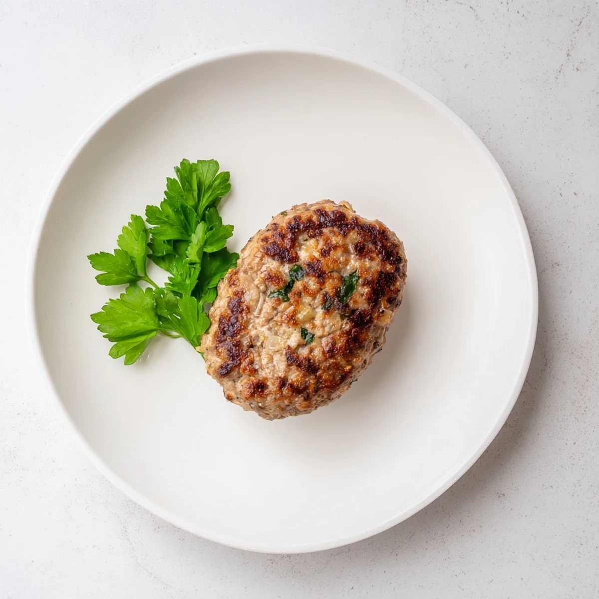 Golden-brown Frikadellen, German meatballs served with creamy mashed potatoes, a comforting dinner.