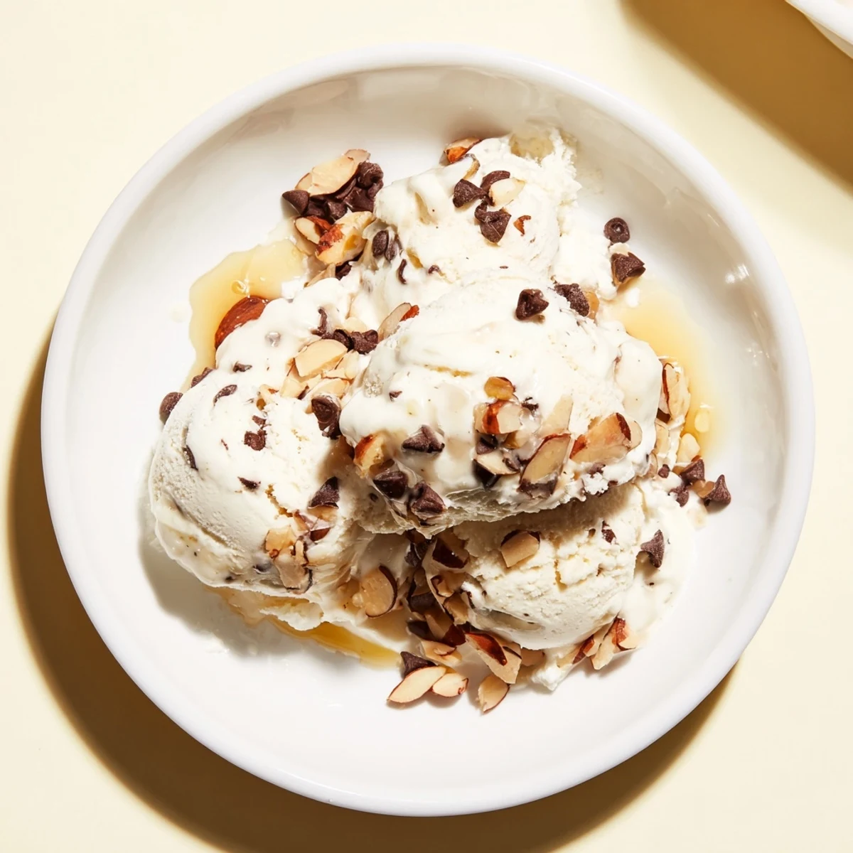 Creamy cottage cheese ice cream with fresh berries, ready to scoop and enjoy.