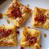 Warm, flaky Chili Crisp Honey Brie Bites: a flavorful appetizer, perfect party food.