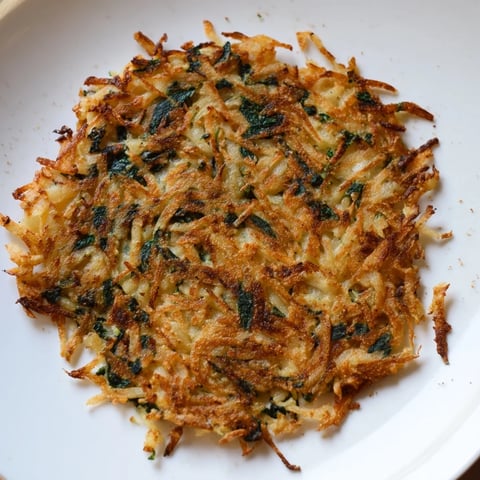 Crispy golden Healthy Potato & Spinach Rösti, served hot, is a delicious, nourishing vegetarian main course.