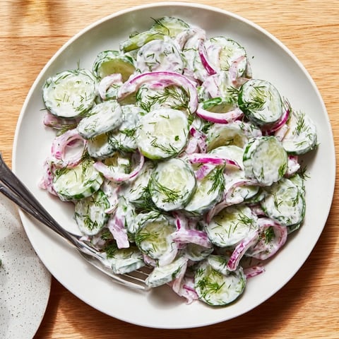 Creamy German Cucumber Salad, a refreshing side dish with sliced cucumbers and creamy dressing.