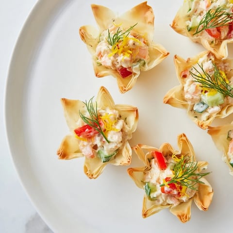 Golden, crispy Mini Star Cocktail Cups filled with savory shrimp salad, perfect party appetizer.