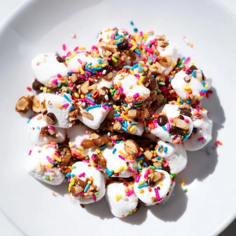 Gooey, quick dessert: Chocolate Chips and Mini Marshmallows heap, showing melted chocolate and puffy marshmallows.