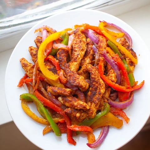 Here are three SEO-optimized ALT texts for the Sheet-Pan Chicken Fajitas photo: