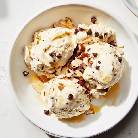 A close-up shot of homemade cottage cheese ice cream, swirled with chocolate chips.