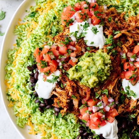 This photo features a colorful Chipotle Burrito Bowl copycat with tender carnitas, perfect for dinner.